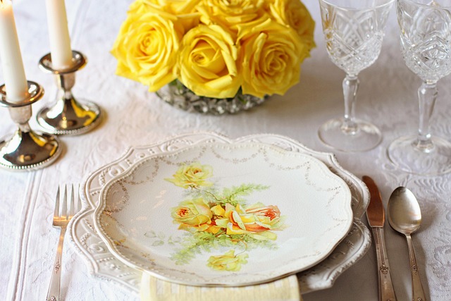 cozy dining table styled with warm white ceramics linen napkins and natural wood